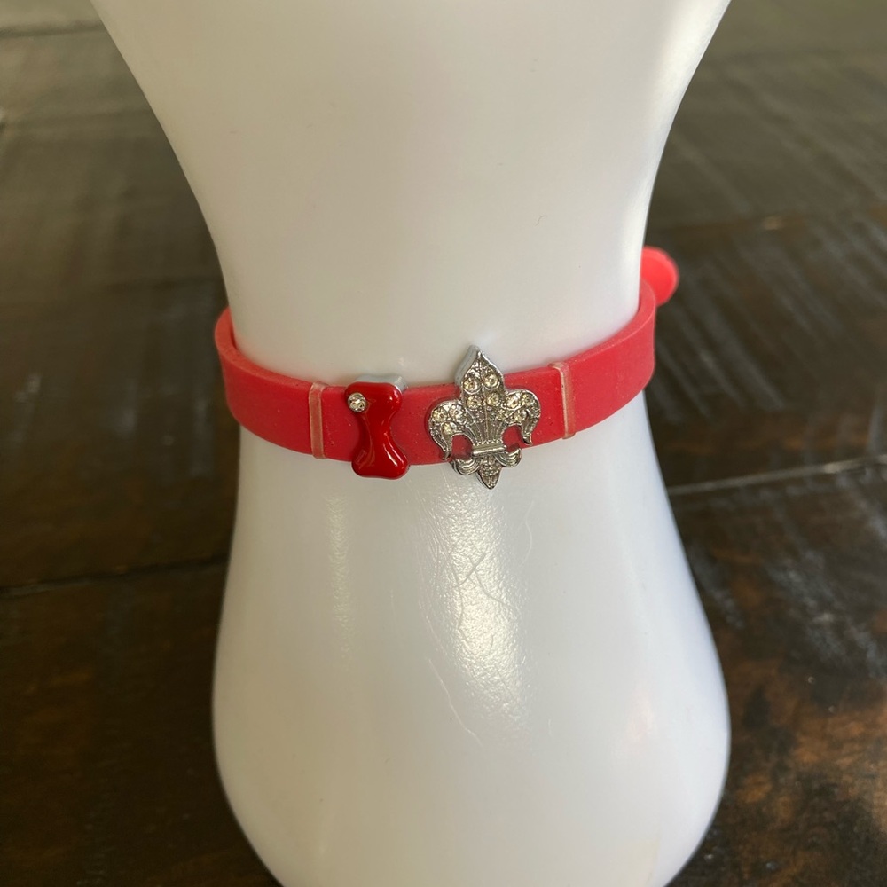 Red Silicone Bracelet with Crystal Fleur-de-Lis and Red Dog Bone Charms